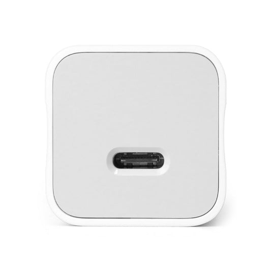 Charger block plugged into wall outlet