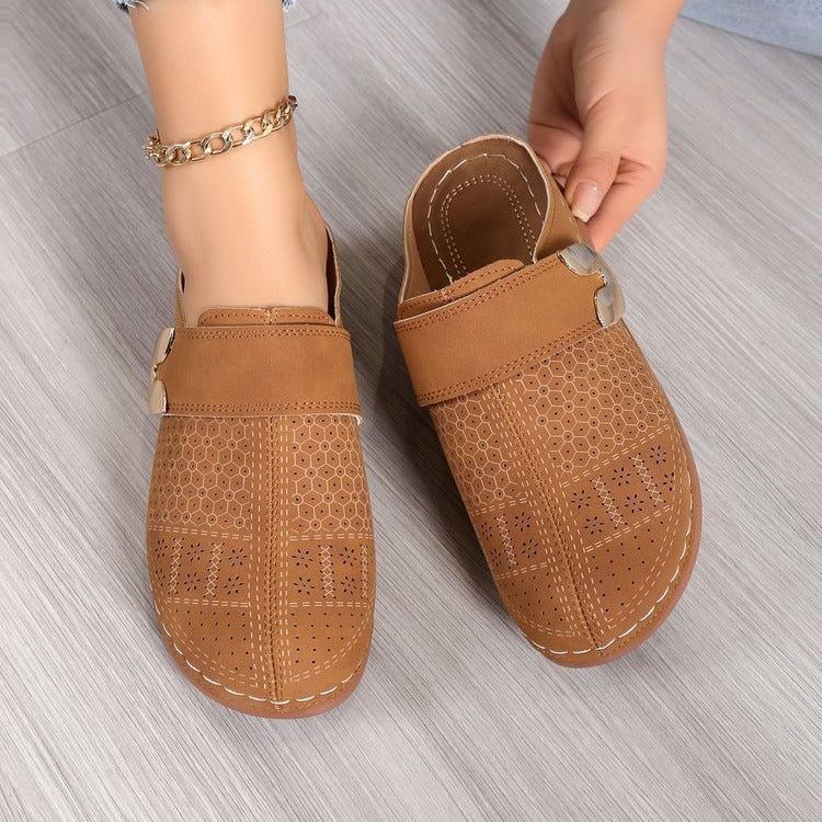 Metal hollow sandals worn outdoors