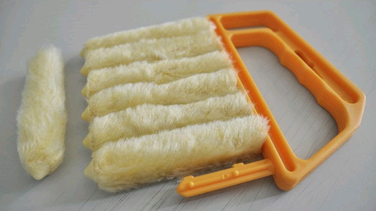 Blind cleaning brush in use between slats