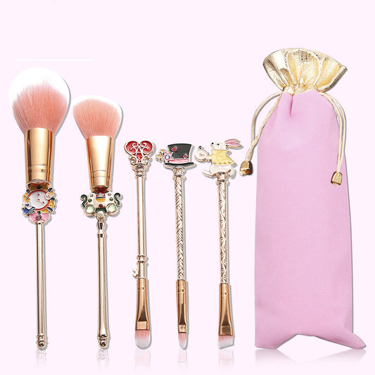 Rose gold and gold makeup brush