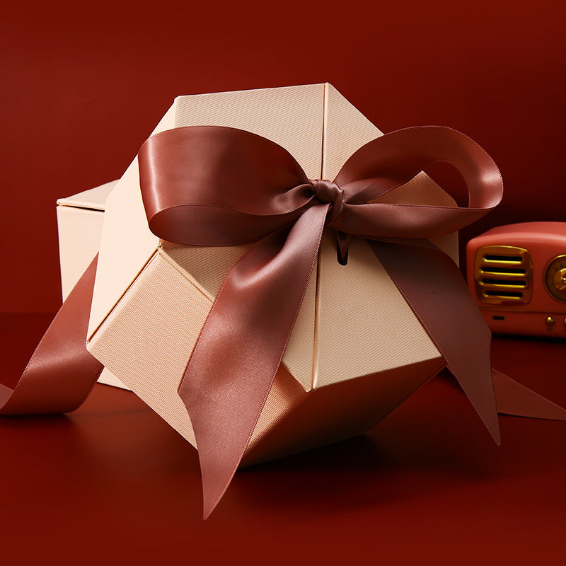 Hexagonal gift box with bow-topped lid