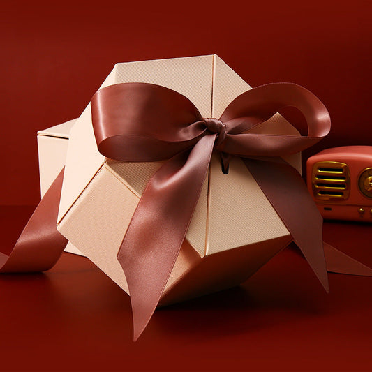 Hexagonal gift box with bow-topped lid