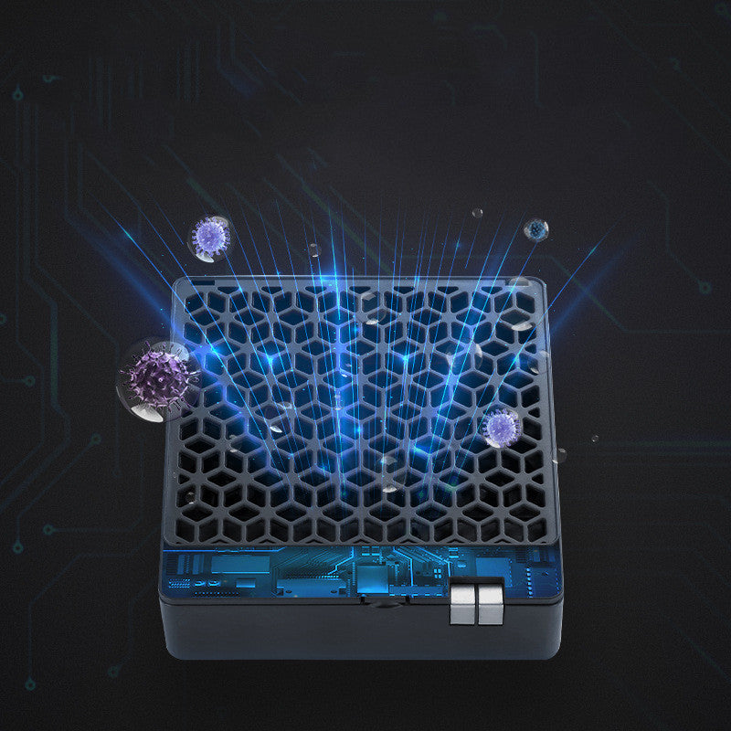 USB air purifier plugged in on a desk