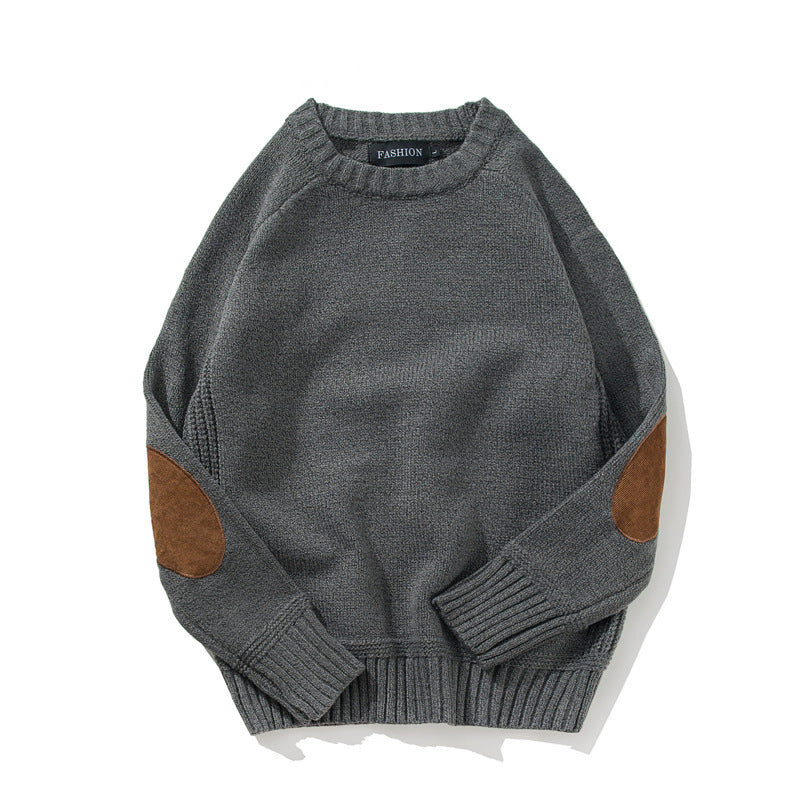 Crew neck patch sweater worn, front view