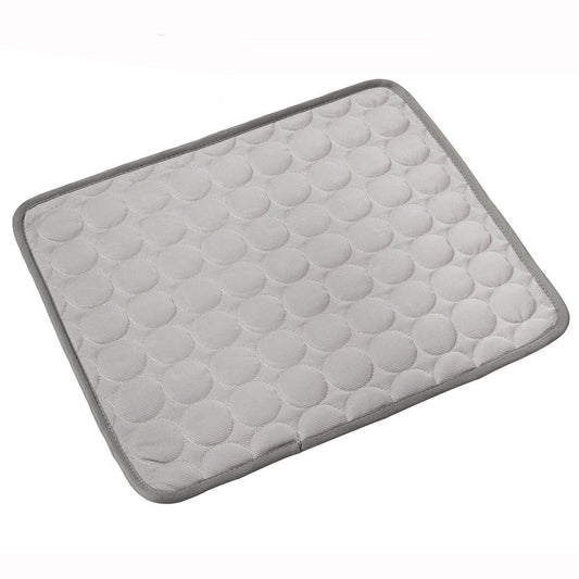 Dog resting on cooling mat