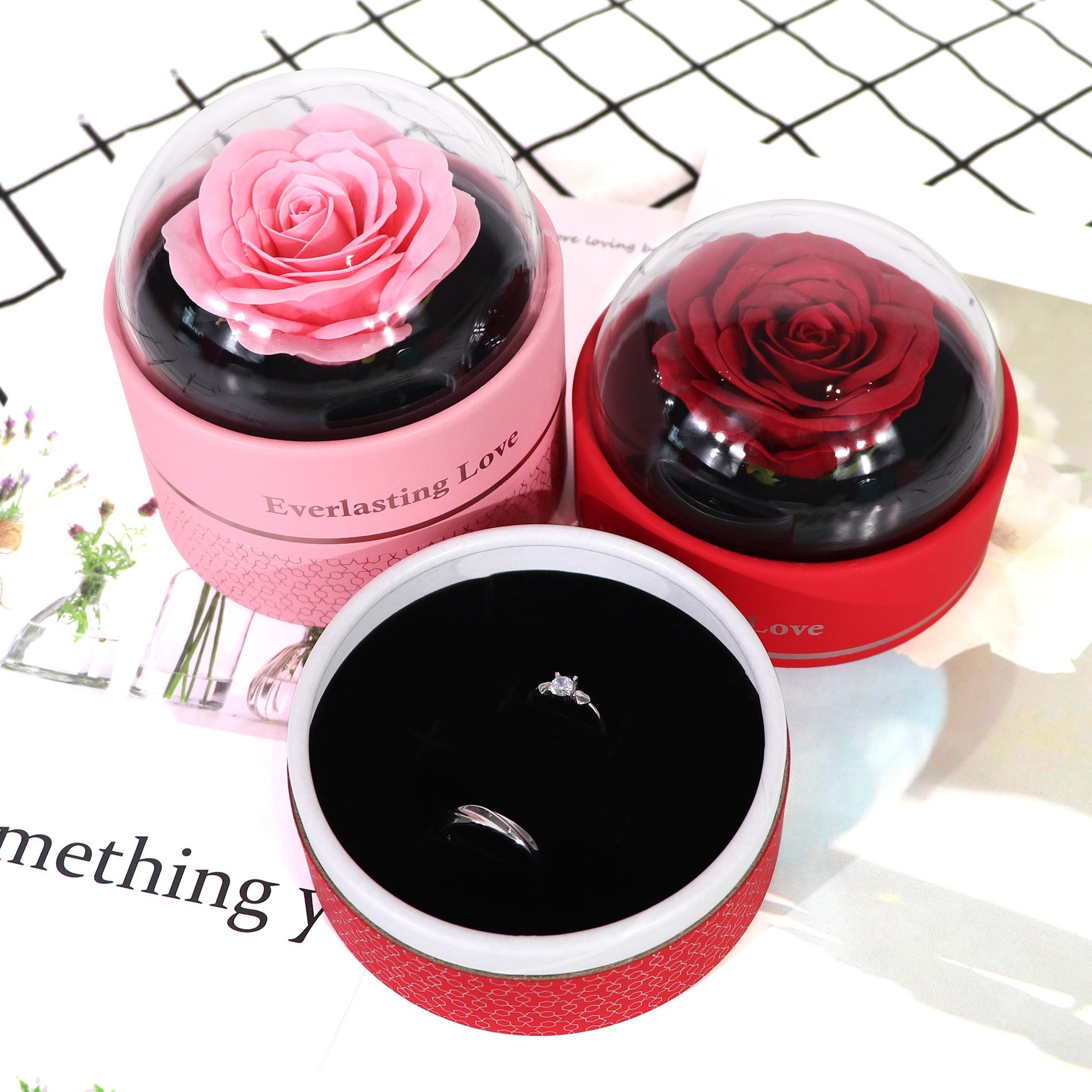 Round jewelry gift box shown with matching gift bag