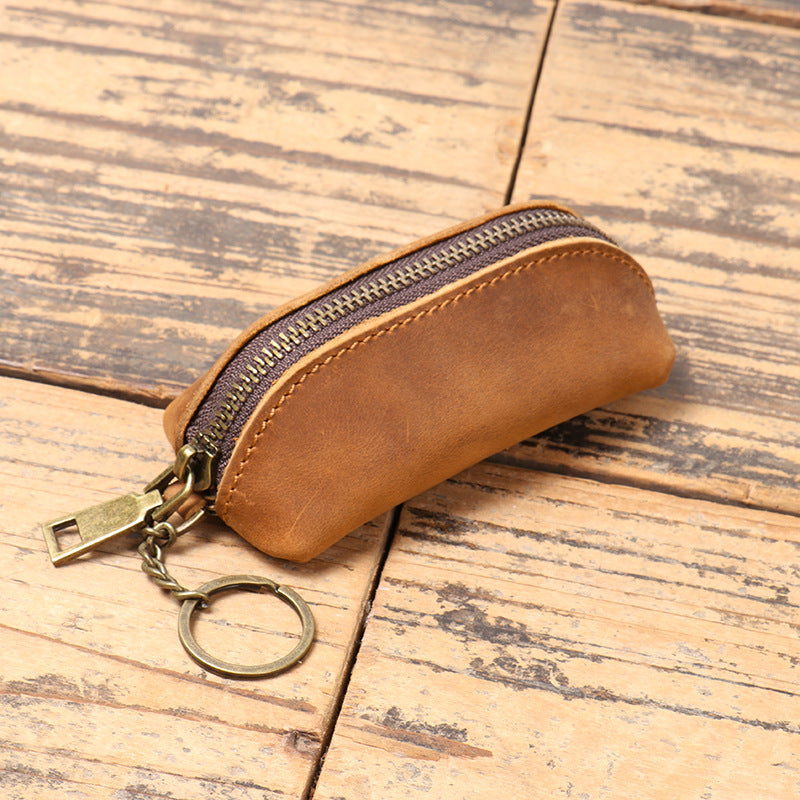 Clutch purse held in hand to show size and scale