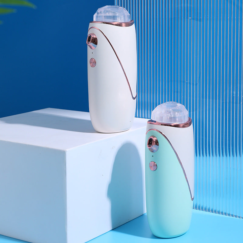 Handheld cold-spray facial mister, white, front view