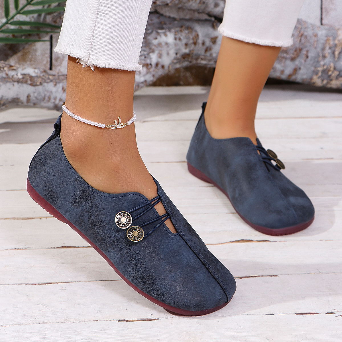 Slip-on flat shoes worn outdoors