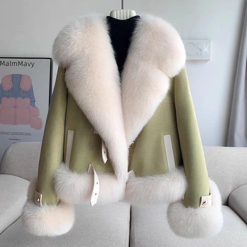 Model wearing oversized faux fur coat outdoors