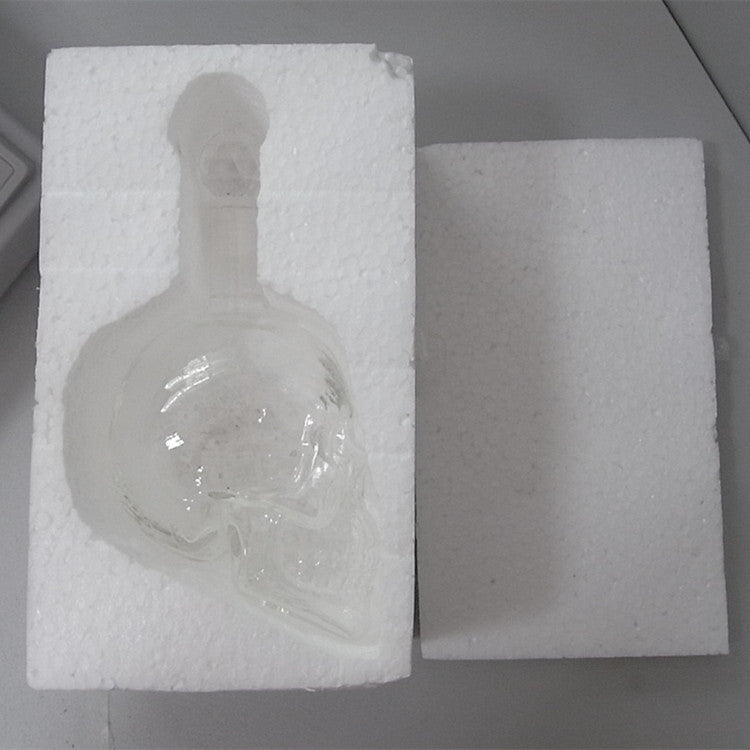 Skull decanter bottle filled with wine