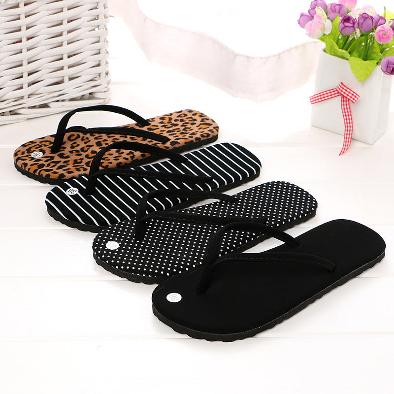 Women's non-slip flat flip flops in black stripe, dot, leopard, and solid black