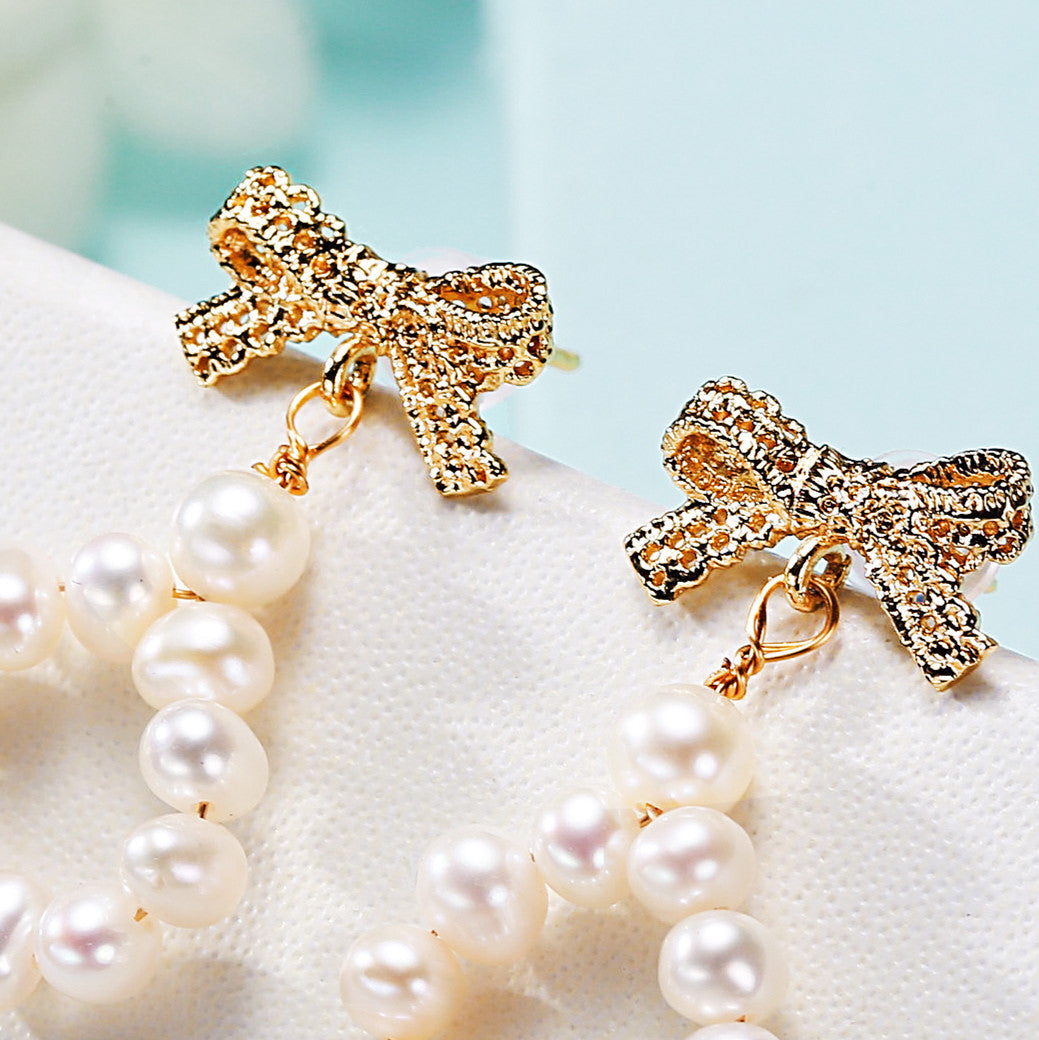 Freshwater pearl earrings bow detail