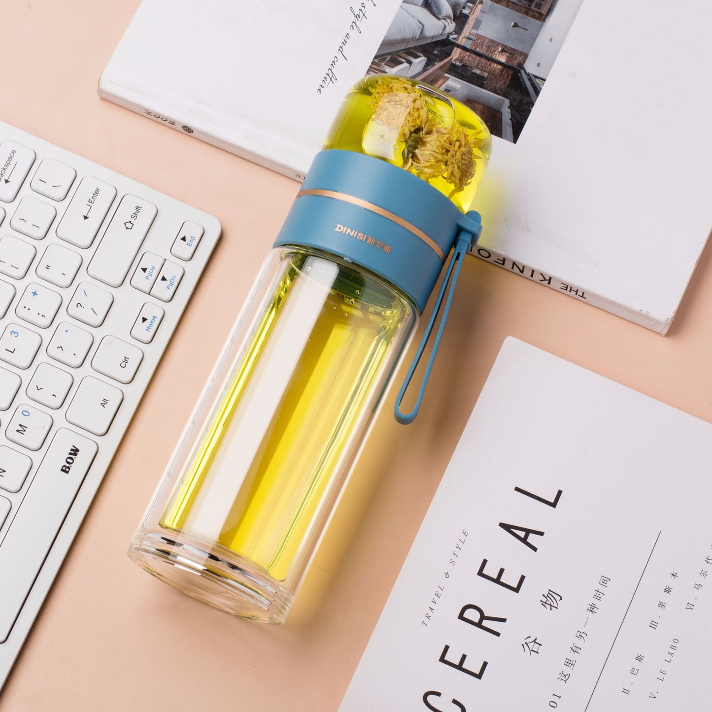 Glass water bottle with tea infuser, lifestyle shot