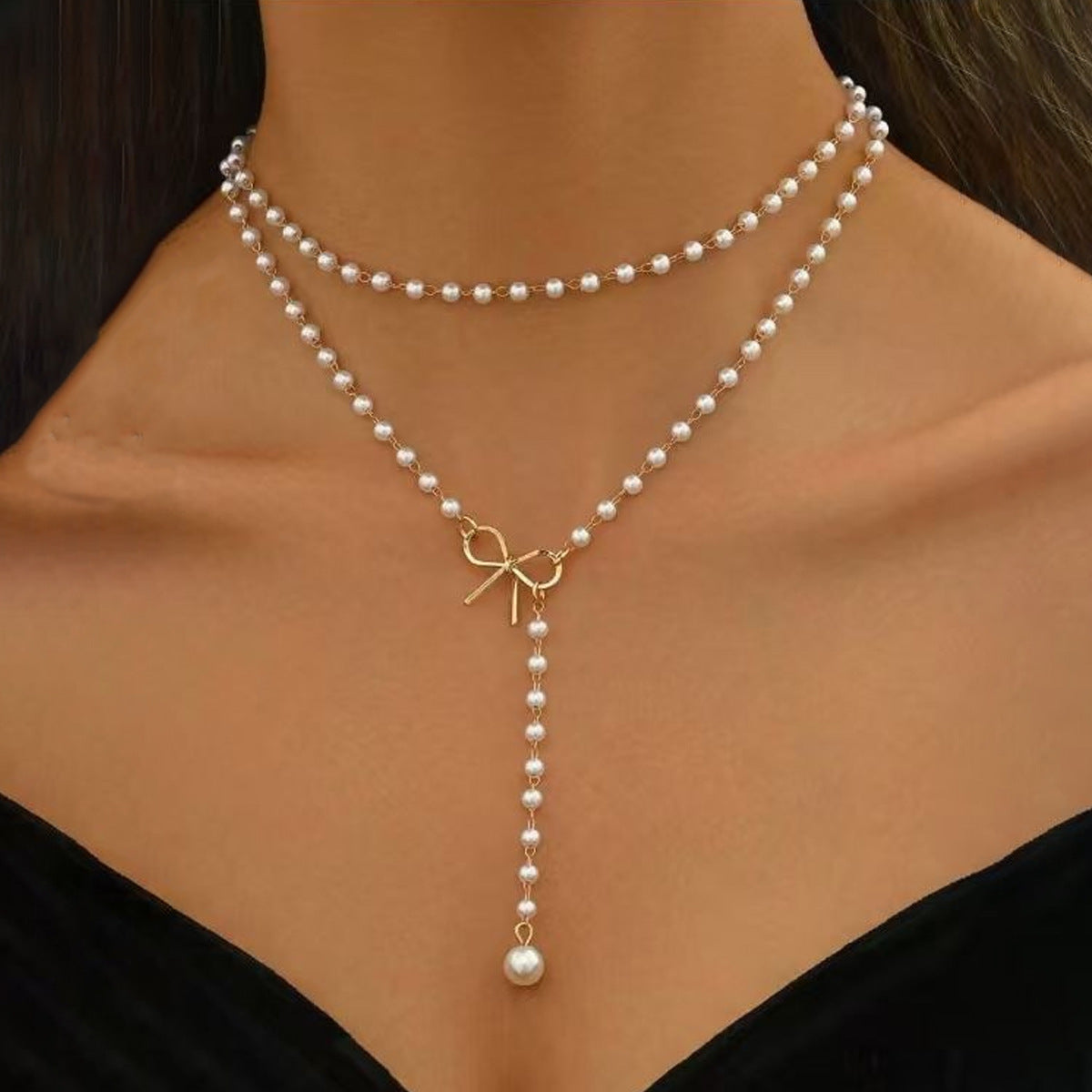Bow tassel pendant necklace