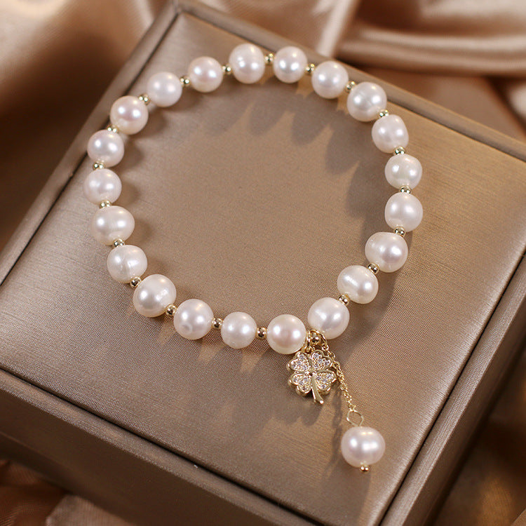 Freshwater pearl four-leaf clover bracelet, styled with outfit