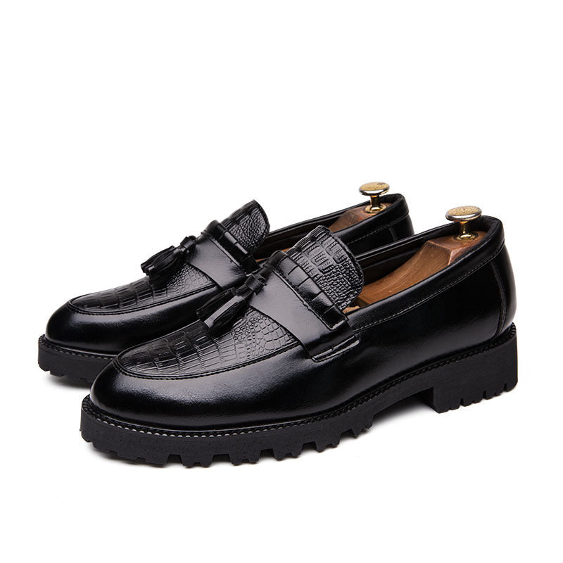 Pair of dress shoes styled with business outfit