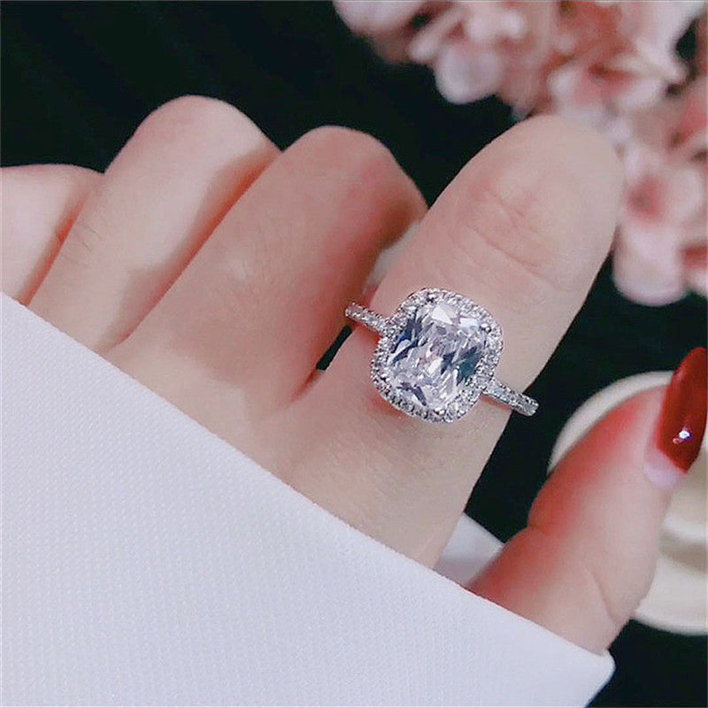 Silver tone wedding ring angled view
