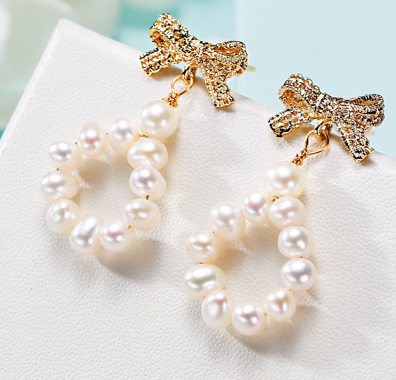 Freshwater pearl earrings worn