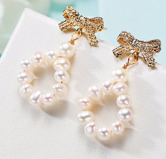 Freshwater pearl earrings worn