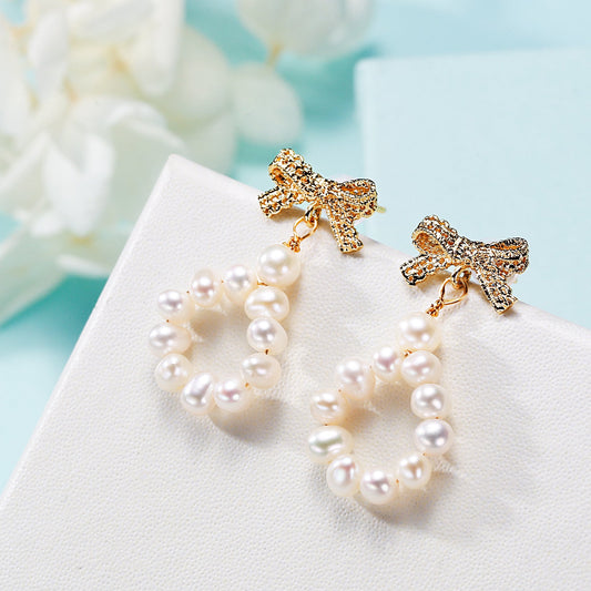 Freshwater pearl bow earrings, front view