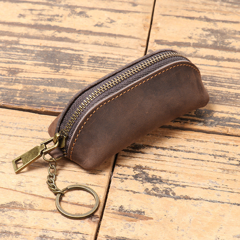 Leather clutch shown in dark coffee colorway