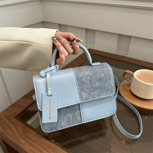 Patchwork tote bag carried by model