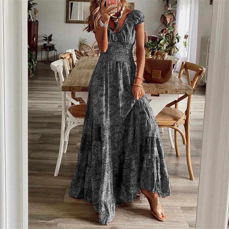 Pleated waist-cinching dress worn, front